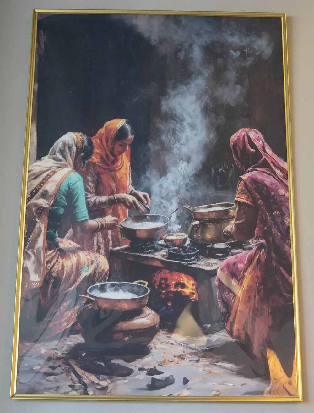 Painting of village women cooking over a clay stove, hanging in the Mehfil dining room