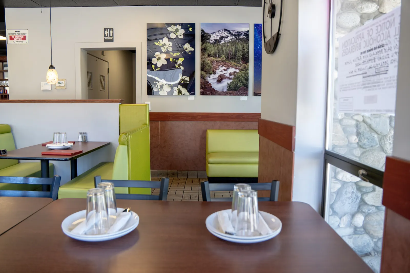 A table at Mehfil beside Tahoe landscape photographs